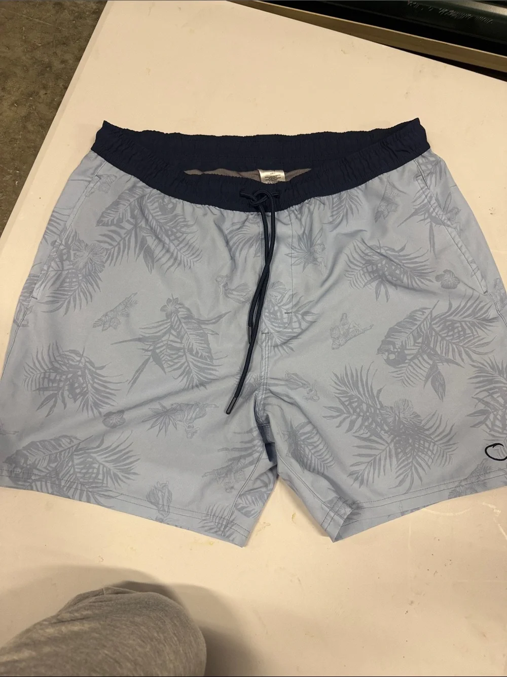 Light Blue Tropical Print Swim Trunks with Navy Waistband